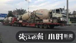 巨無霸來了！半掛車“背”著水泥車欲上高速！